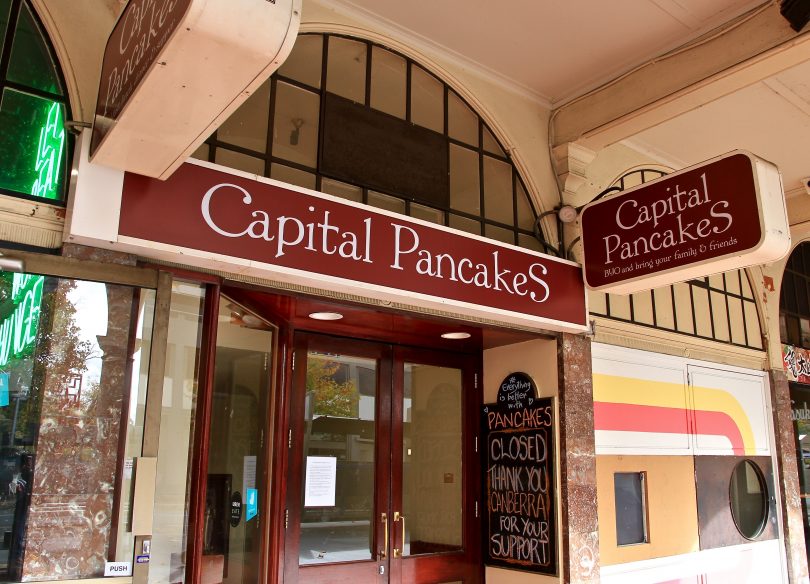 The closed sign on the doors of Capital Pancakes in Civic.