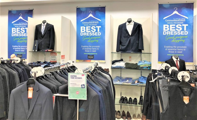 Racks of corporate clothing at Best Dressed Store.