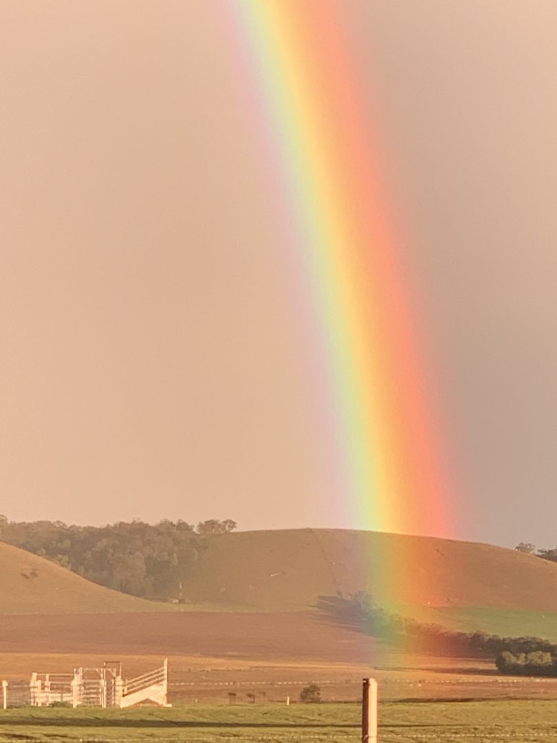 A rainbow over paddocks near Braidwood.
