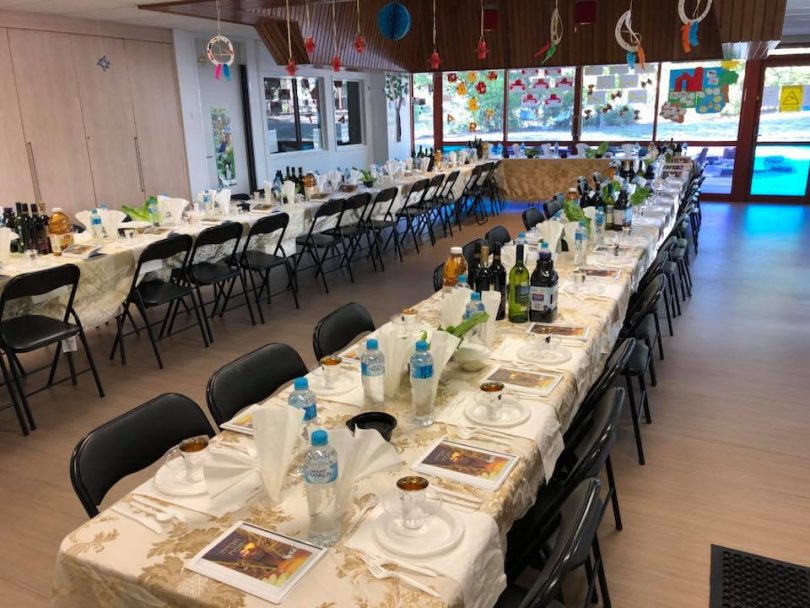 Long dining tables set at Chabad ACT.
