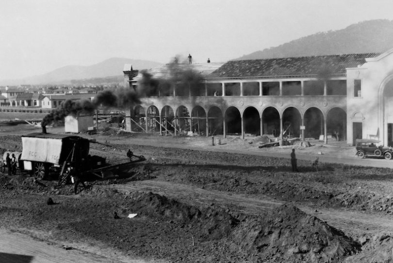 Part of Sydney Building under construction in 1927. View from Melbourne Building showing Keystone steam shovel excavating Northbourne Avenue. Left background is Canberra Times, Meyers Bakery, T.J.Sheeky, Cordial Factory in Mort Street.