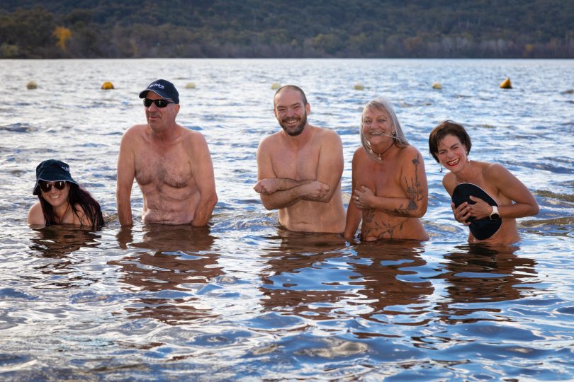 Five people in the water of Lake Burley Griffin