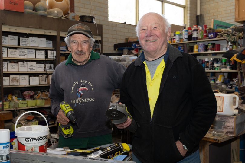 Dennis Taylor and Dr Russell Brown holding tools
