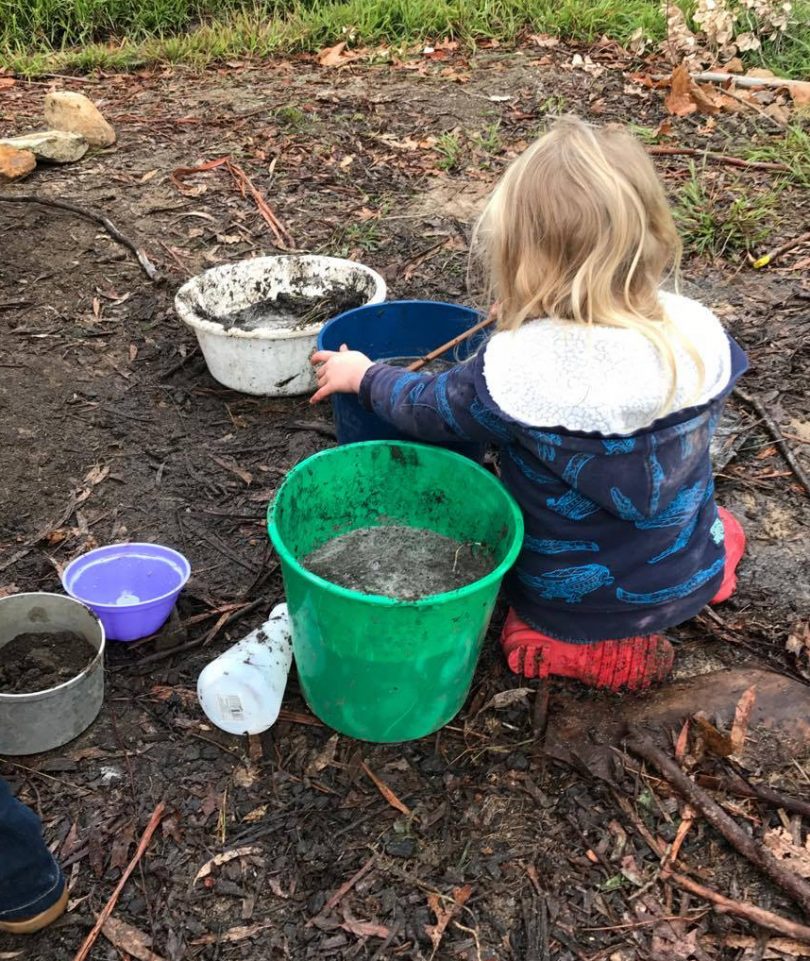 Child plays in mud