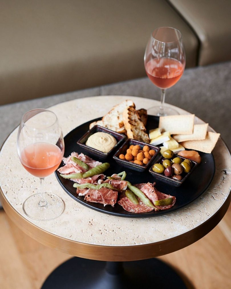 antipasto platter and wine glasses