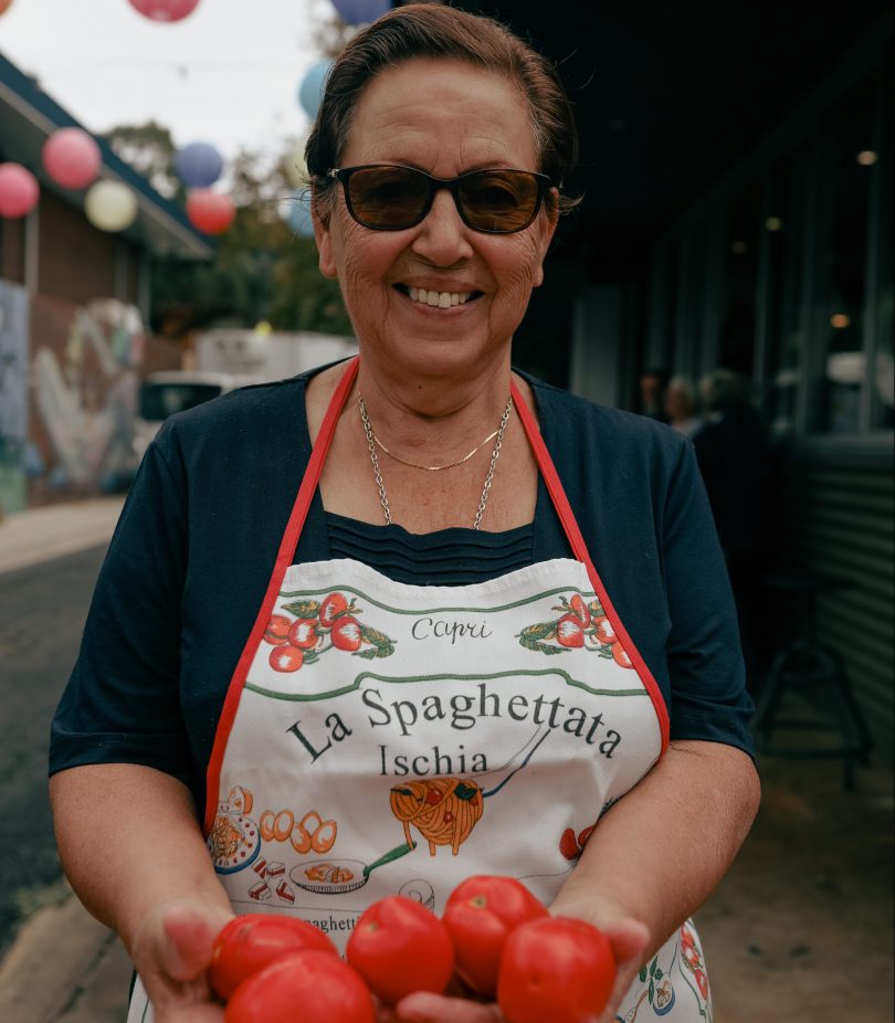 Nonna Rosa Lanzetta holding tomatoes