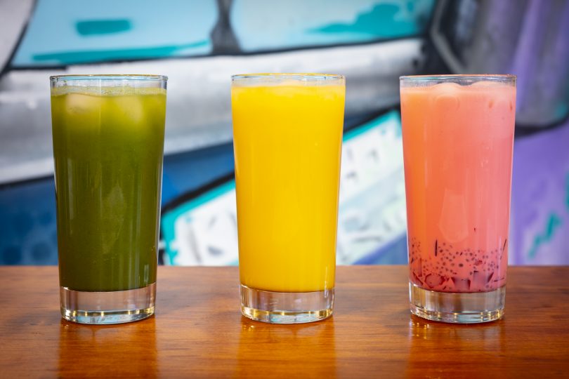 Three drinks, green, yellow and pink