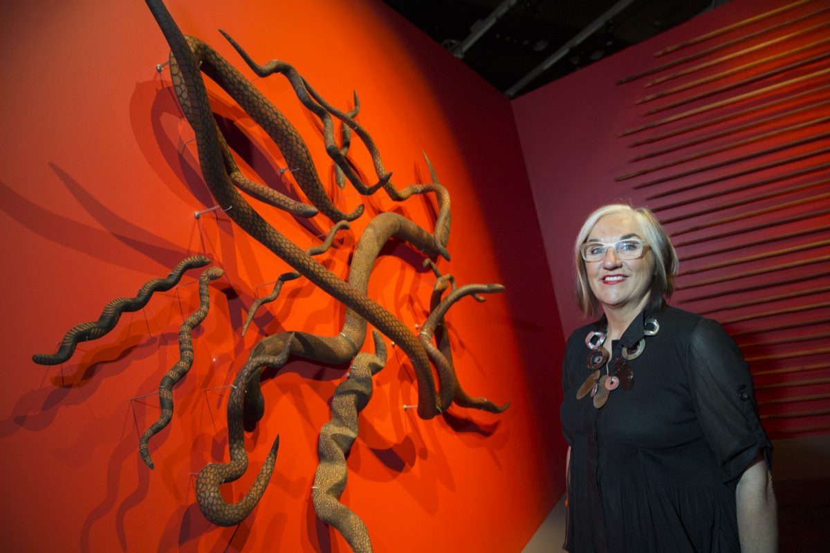 Margo Neale in front of Indigenous art