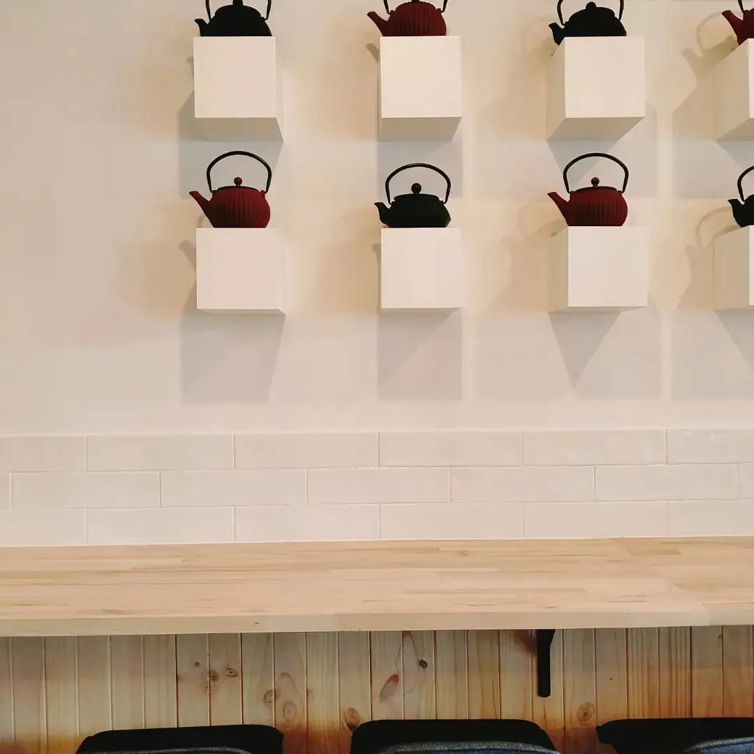 Teapots on wall