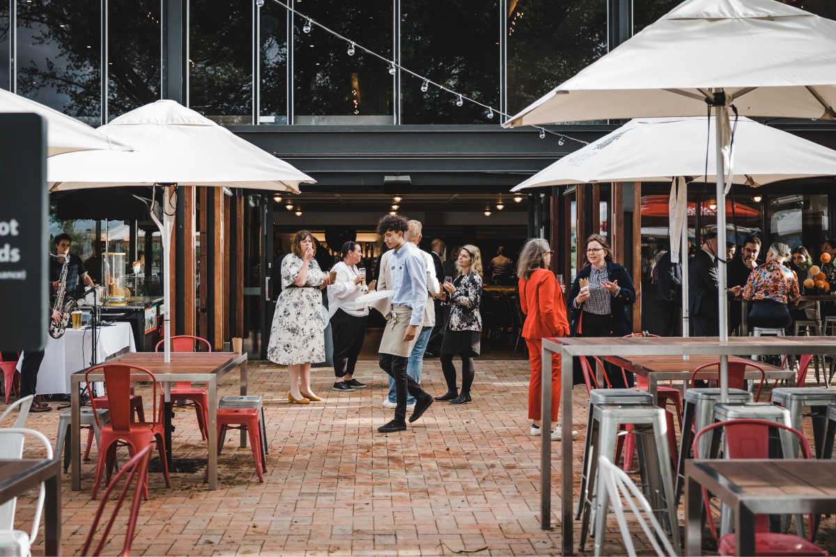 People mill around in the courtyard at Snapper and Co in Yarralumla
