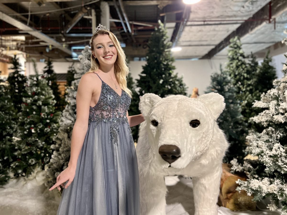 woman with large polar bear model