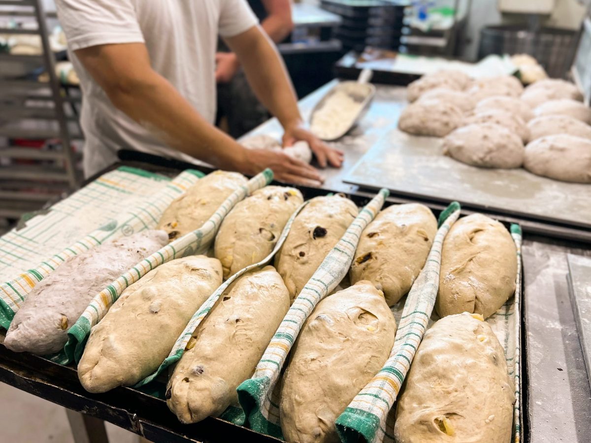 dough being shaped by bakers