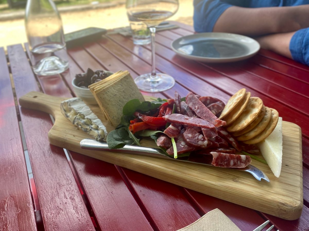 Cheese and salami on wooden board at Lerida Estate
