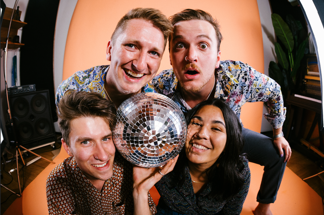 four people with disco ball