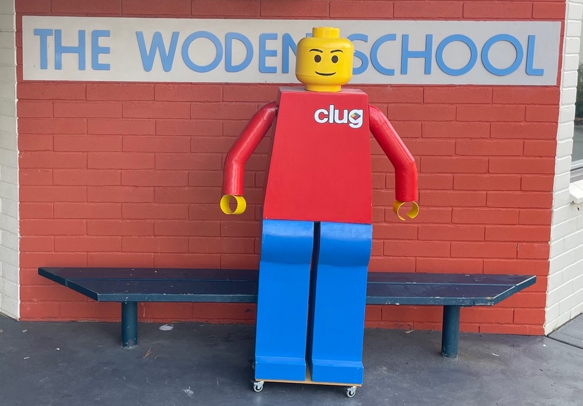 Big LEGO man in front of Woden School sign