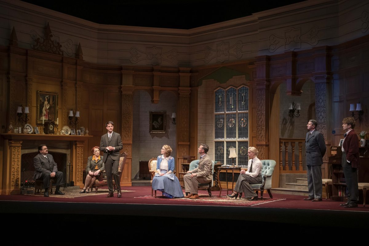 The full cast eight-person performing the play on stage.