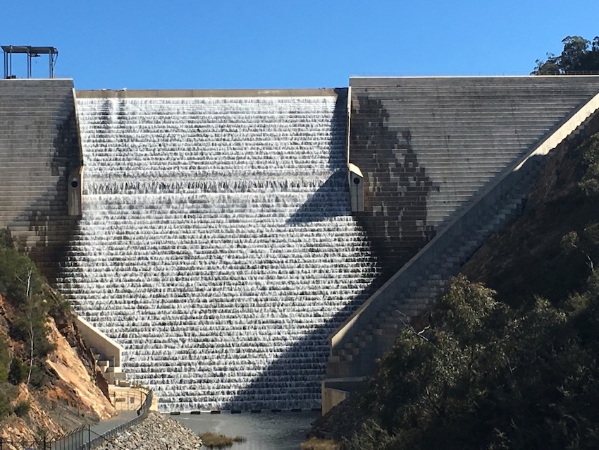 Water flowing over the Cotter dam wall.
