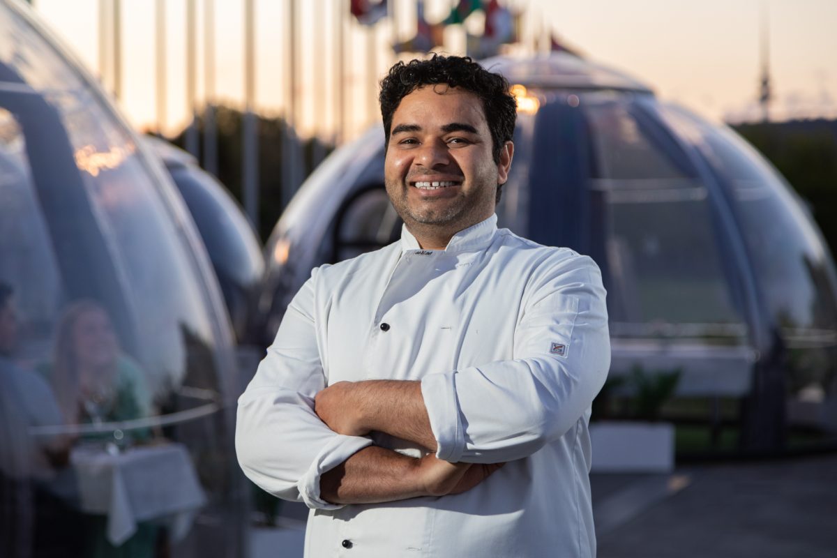chef Avtar Singh in front of dining domes