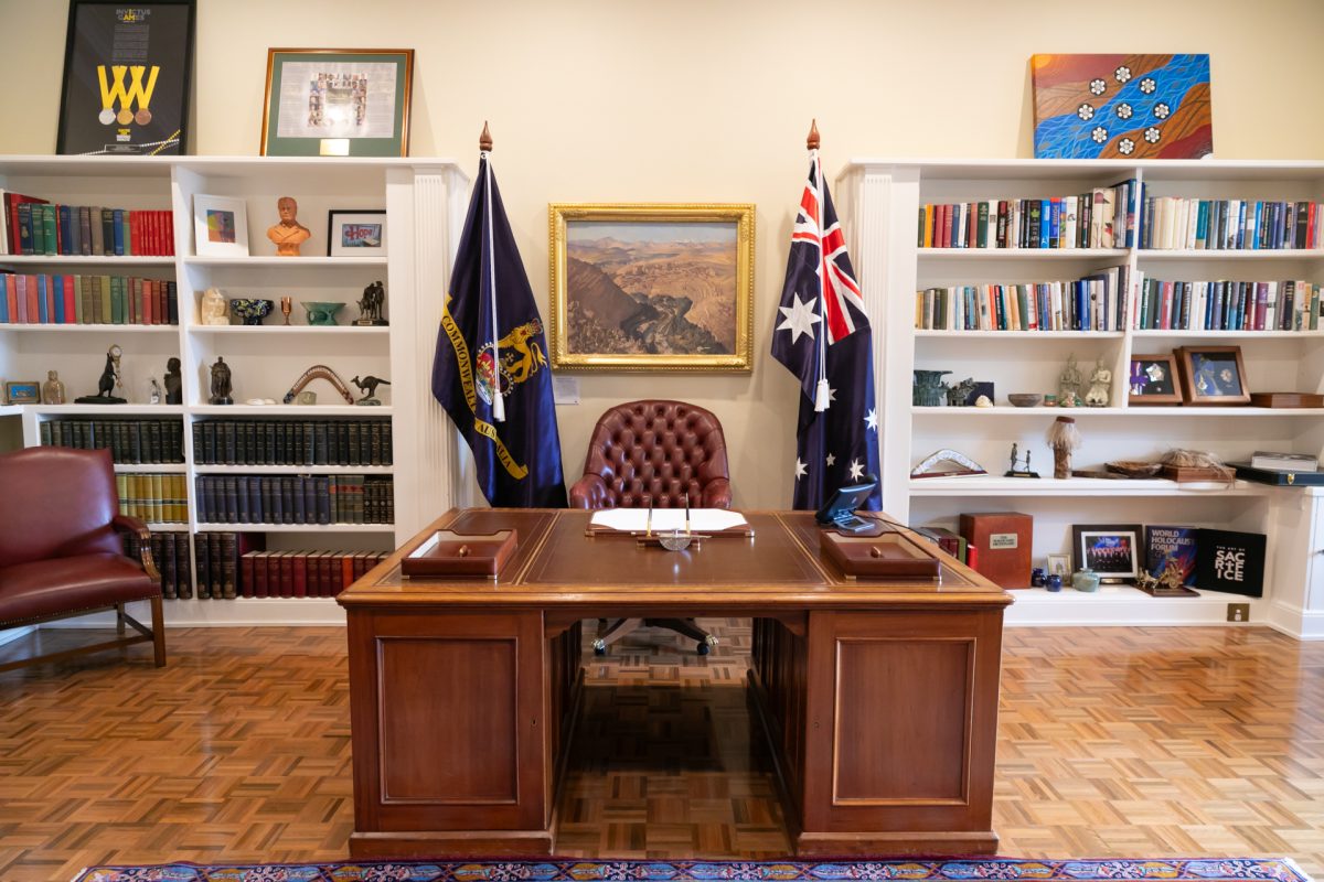 Formal study with flags and bookshelf