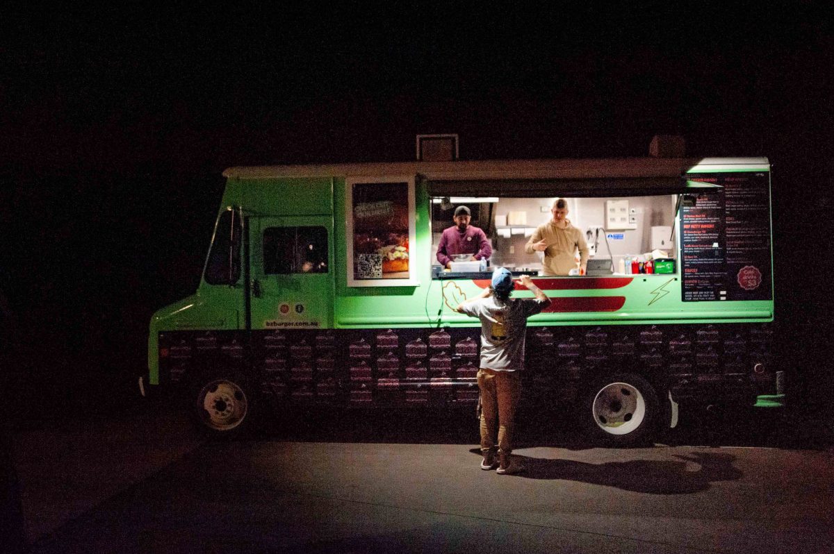 a man buys from a food truck