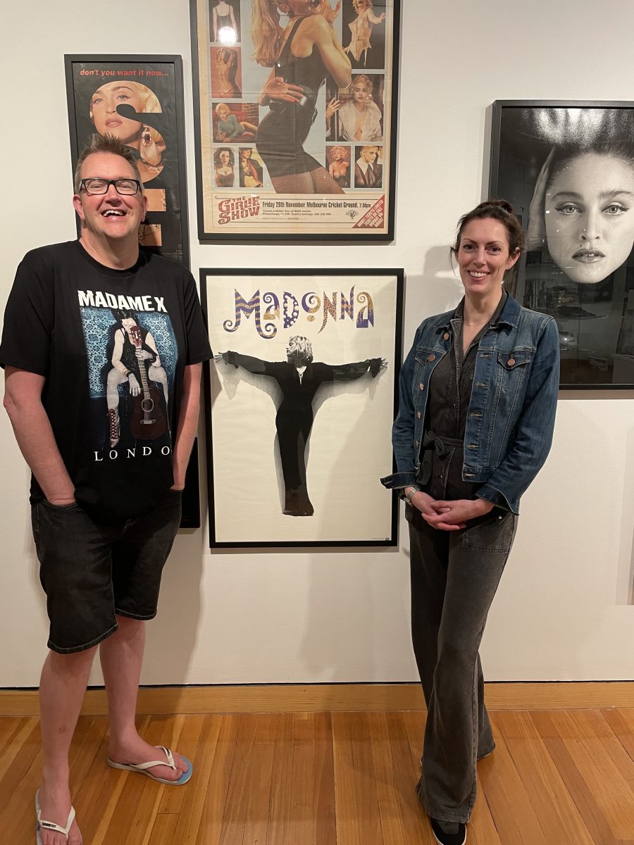 Madonna fan Jerry Kirbell with CMAG curator Hannah Paddon in front of Madonna posters