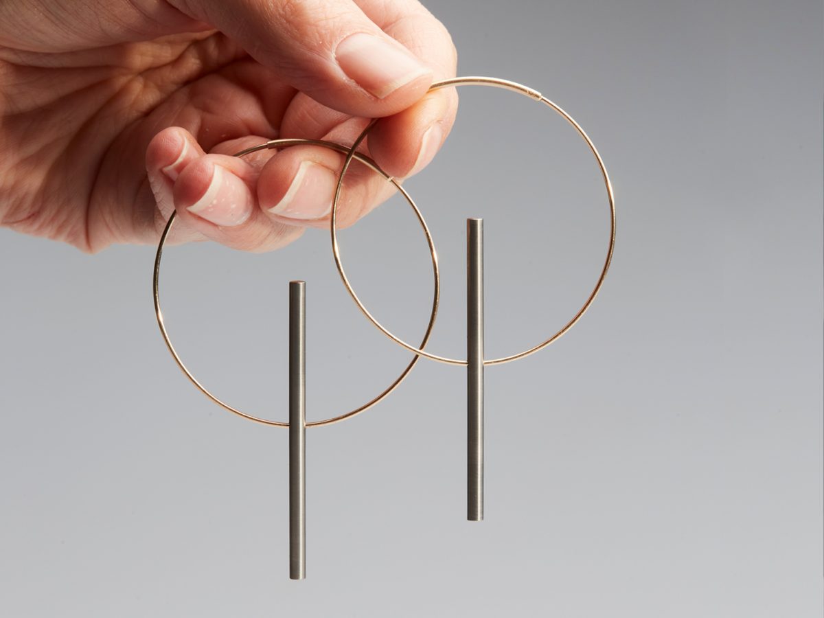 Hoop earrings with cylindrical feature by Phoebe Porter