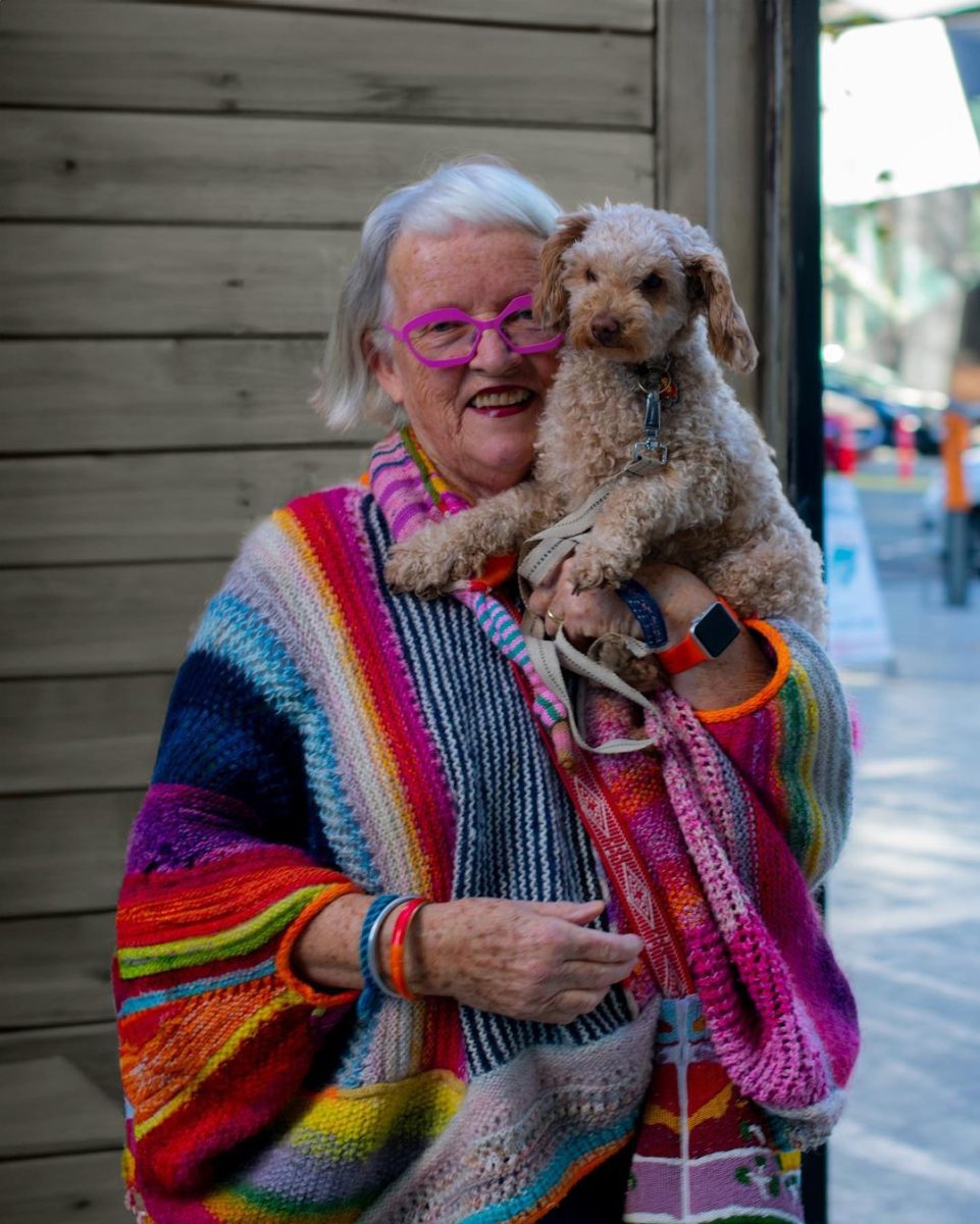 older woman holding a dog