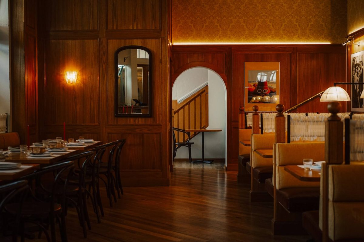 Wooden panelling, booths and retro interior aesthetic. 