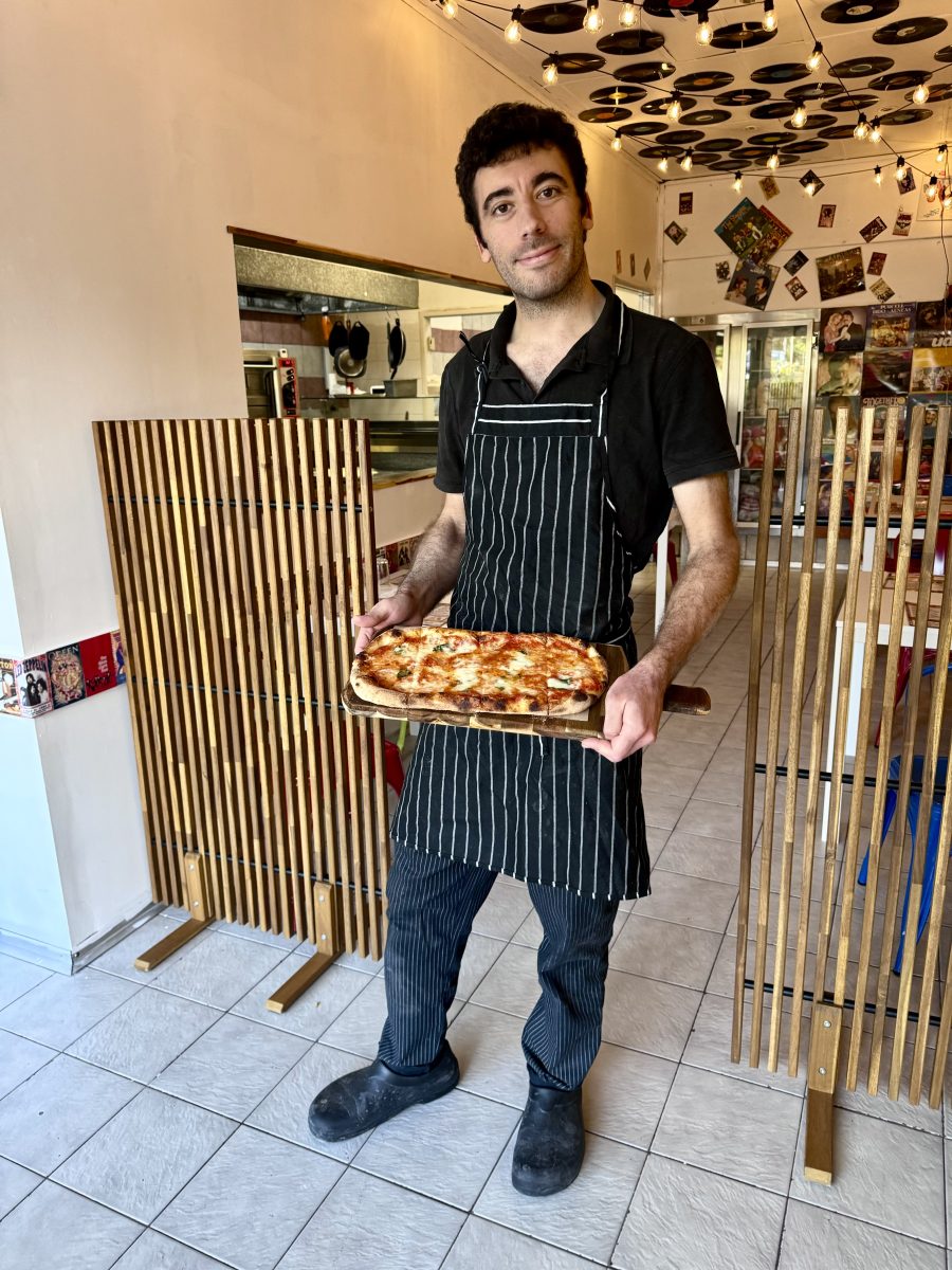 man holding pizza