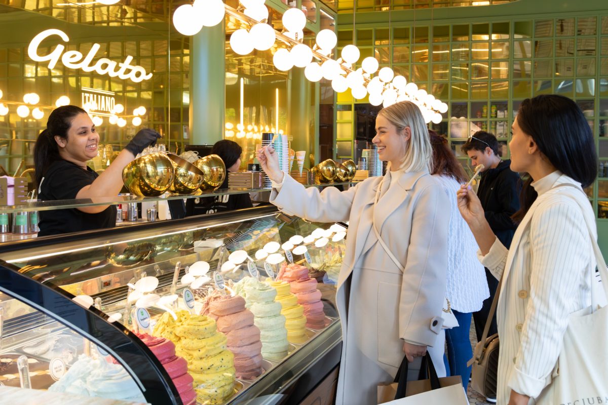 Two ladies tasting and eating gelato at Anita