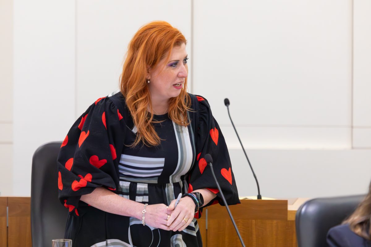 Woman speaking into microphone