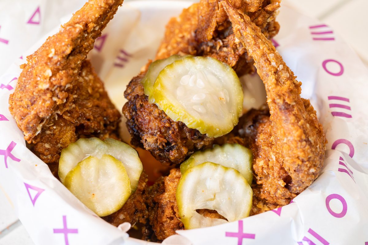 Bowl of chicken wings and pickles