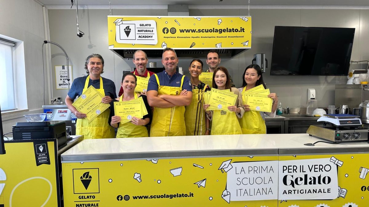 Group photo in yellow aprons