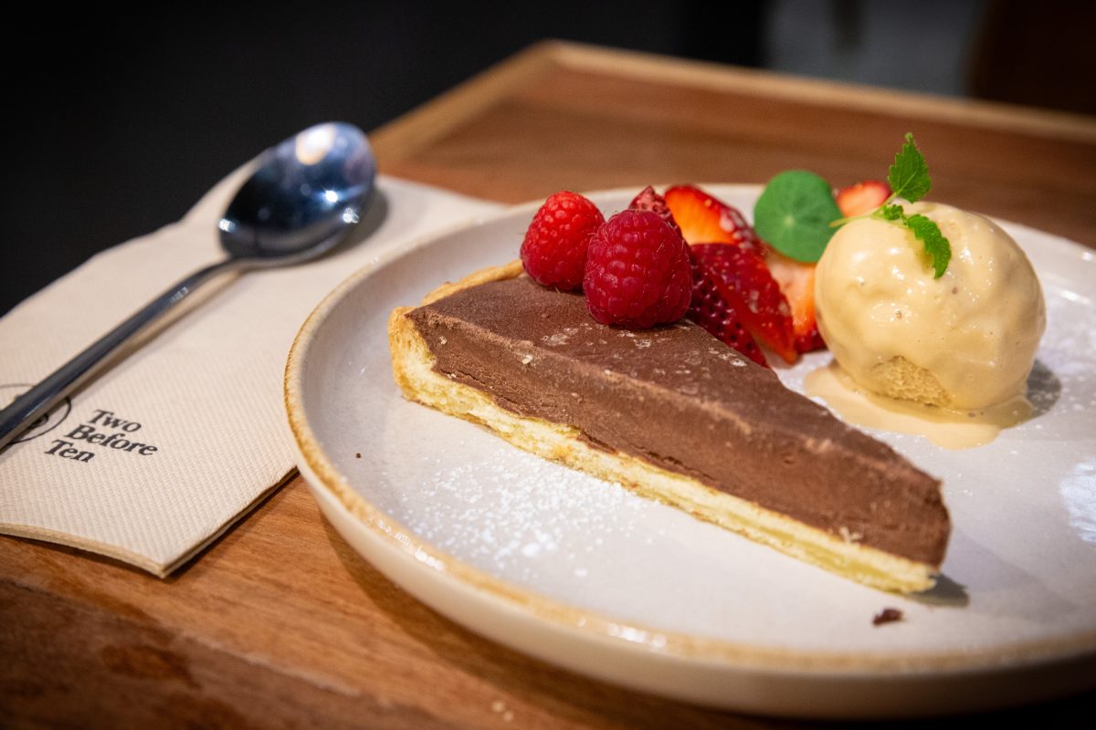 Dark chocolate & sea salt tart served with caramelised white chocolate and toffee ice cream at The Denman Kitchen + Wine Bar.