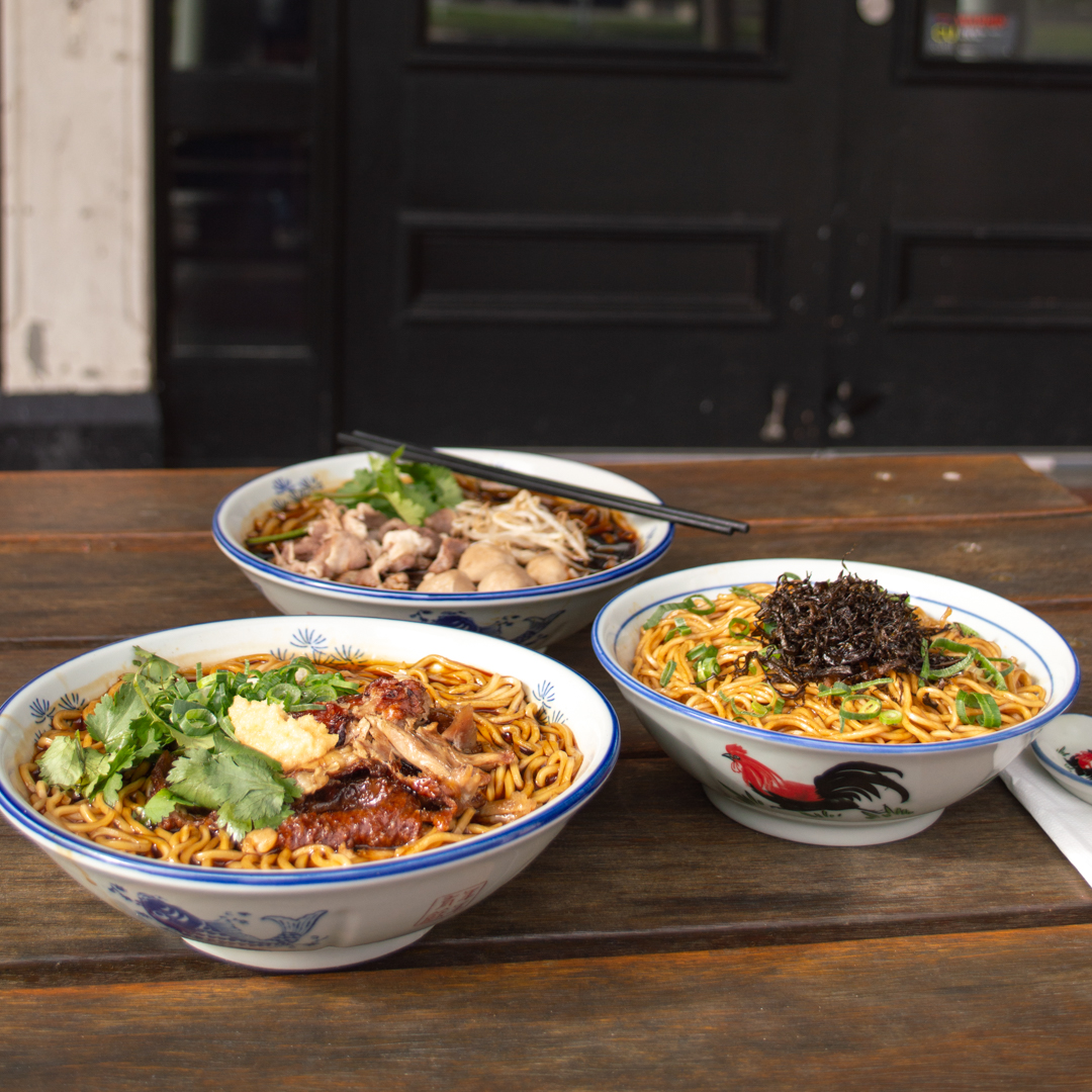 Three bowls of Singapore style noodle dishes.