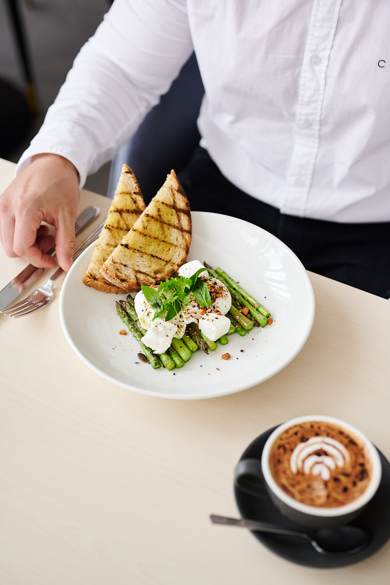 eggs and asparagus with toast and a coffee