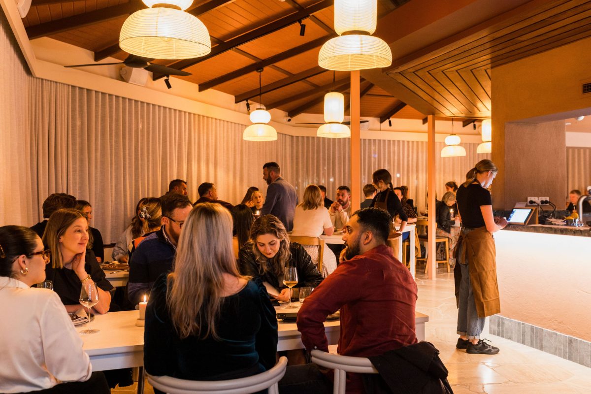 Busy restaurant with warm lighting.