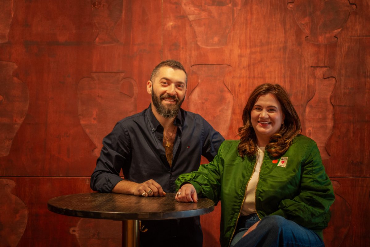 a man and a woman at a bar table