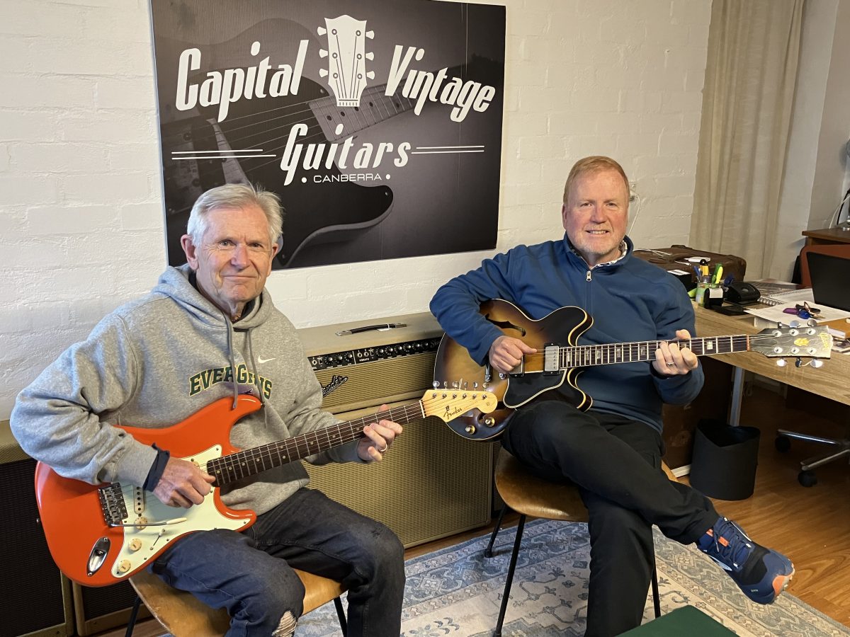 Ian Stehlik and Simon Wilkins of Capital Vintage Guitars holding guitars