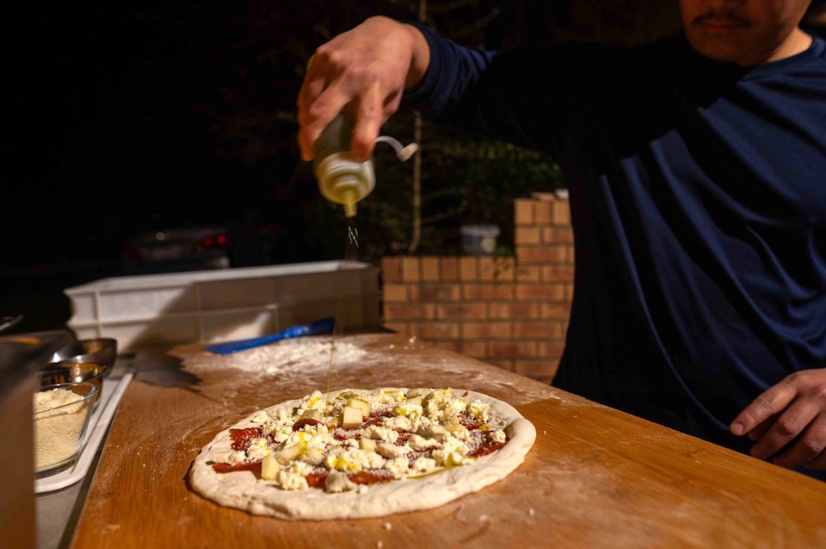 man making pizza