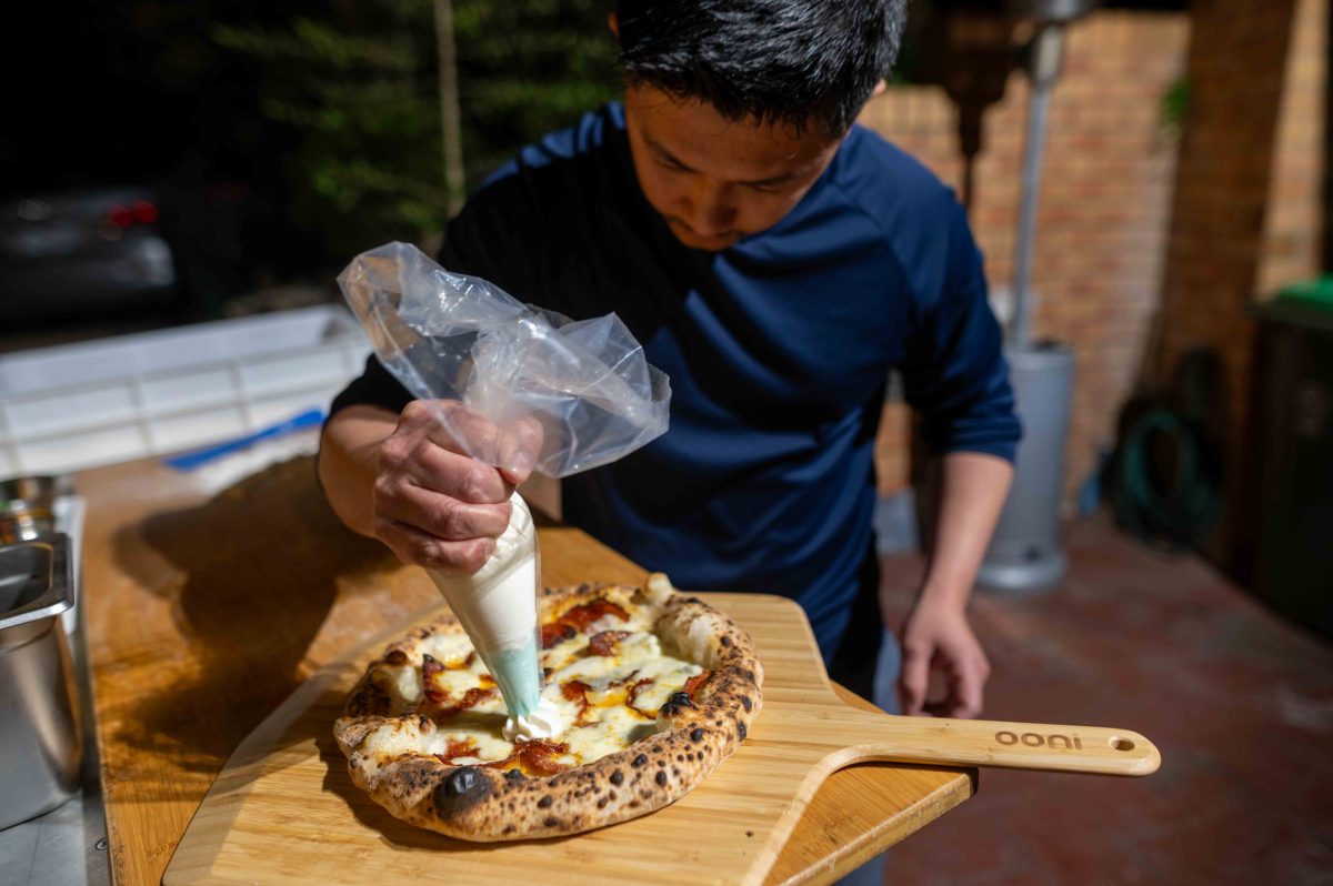 man making pizza