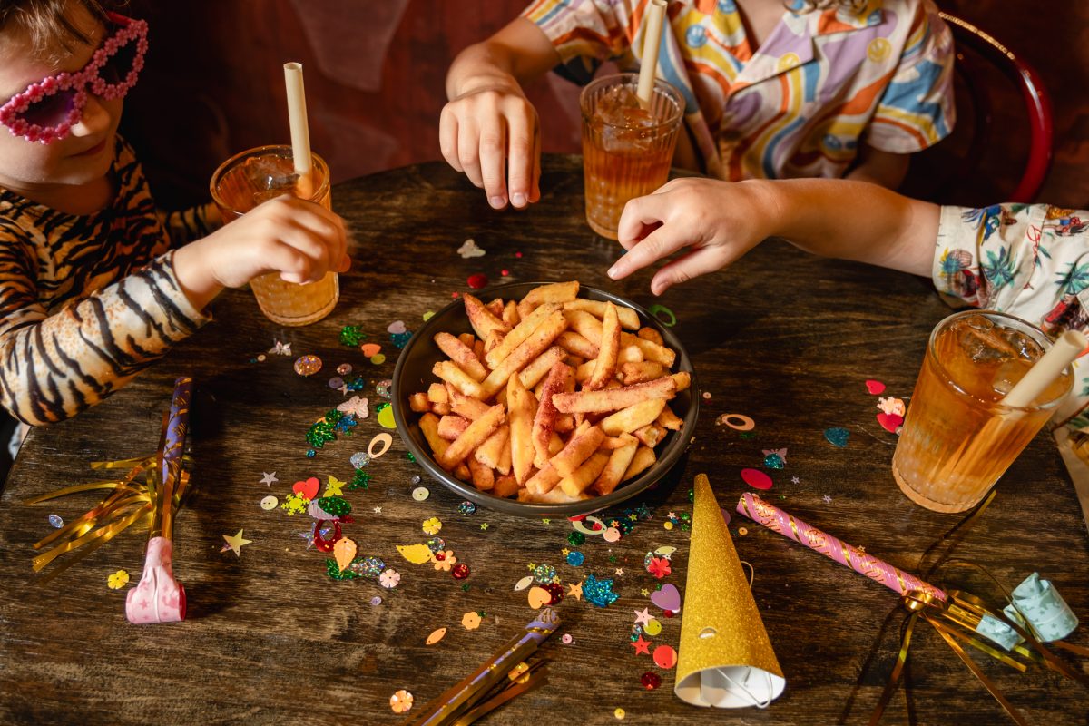 Kids enjoy chips and soft drinks.