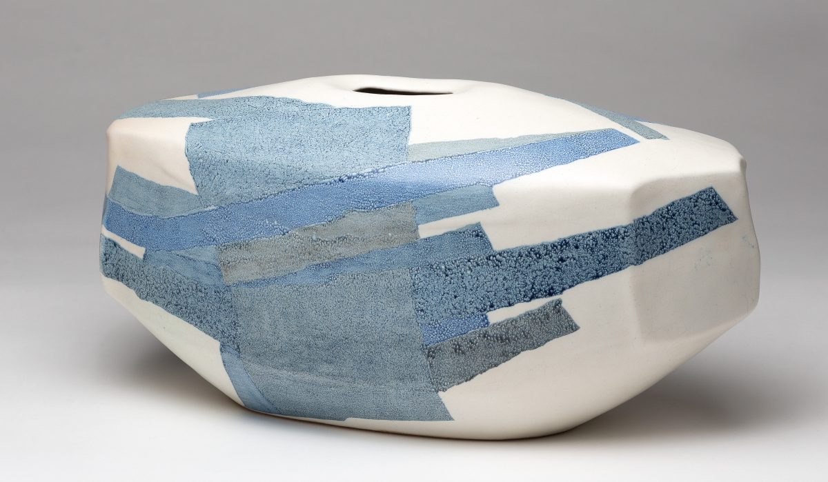 Landscape format photo of a blue and white ceramic pot