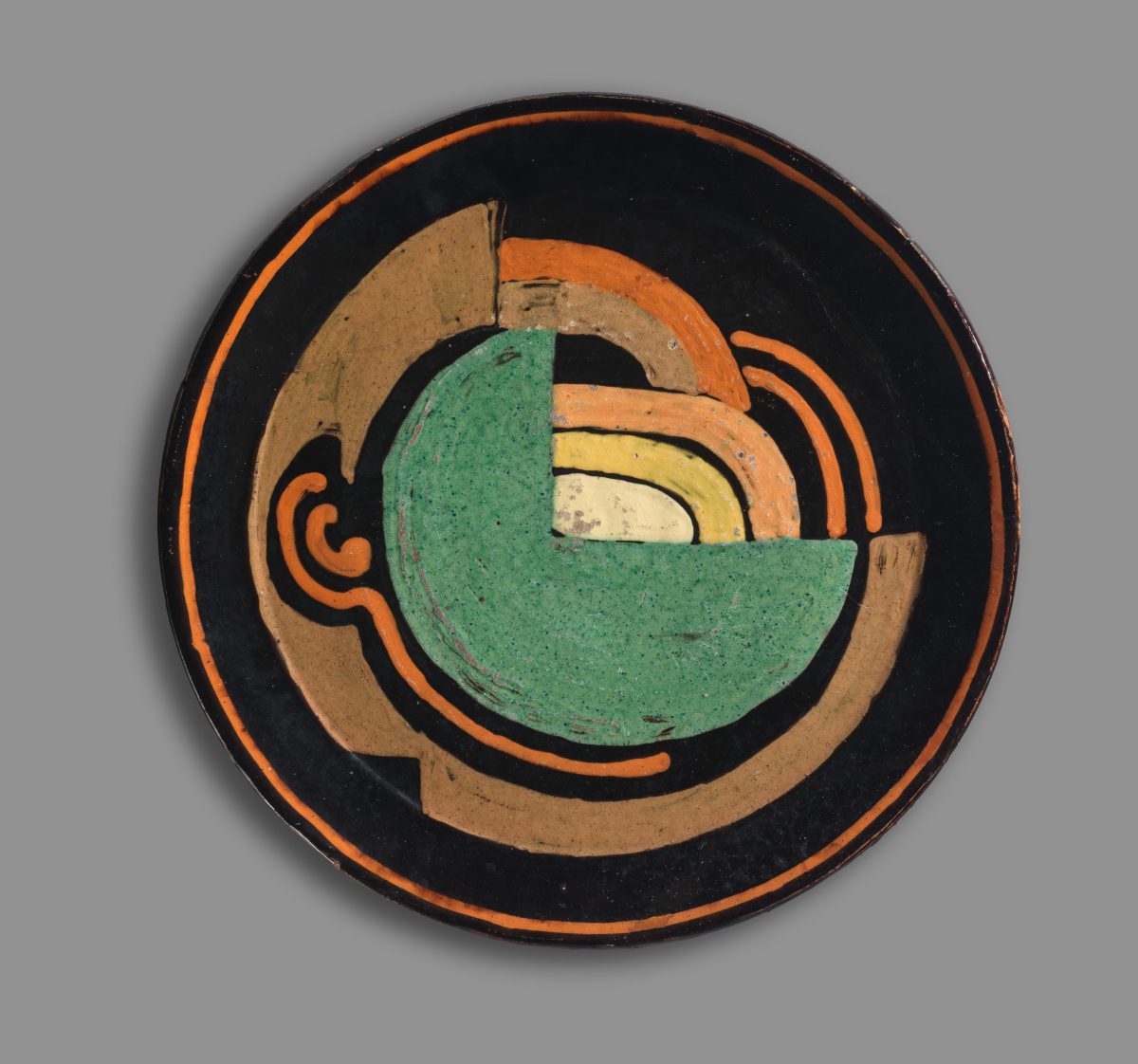 Round colourful plate with geometric design