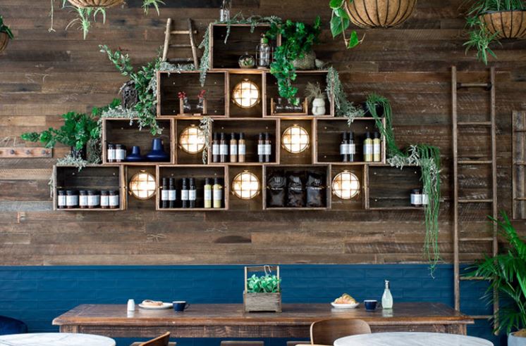 wildflour cafe featuring wall sconce for bottles