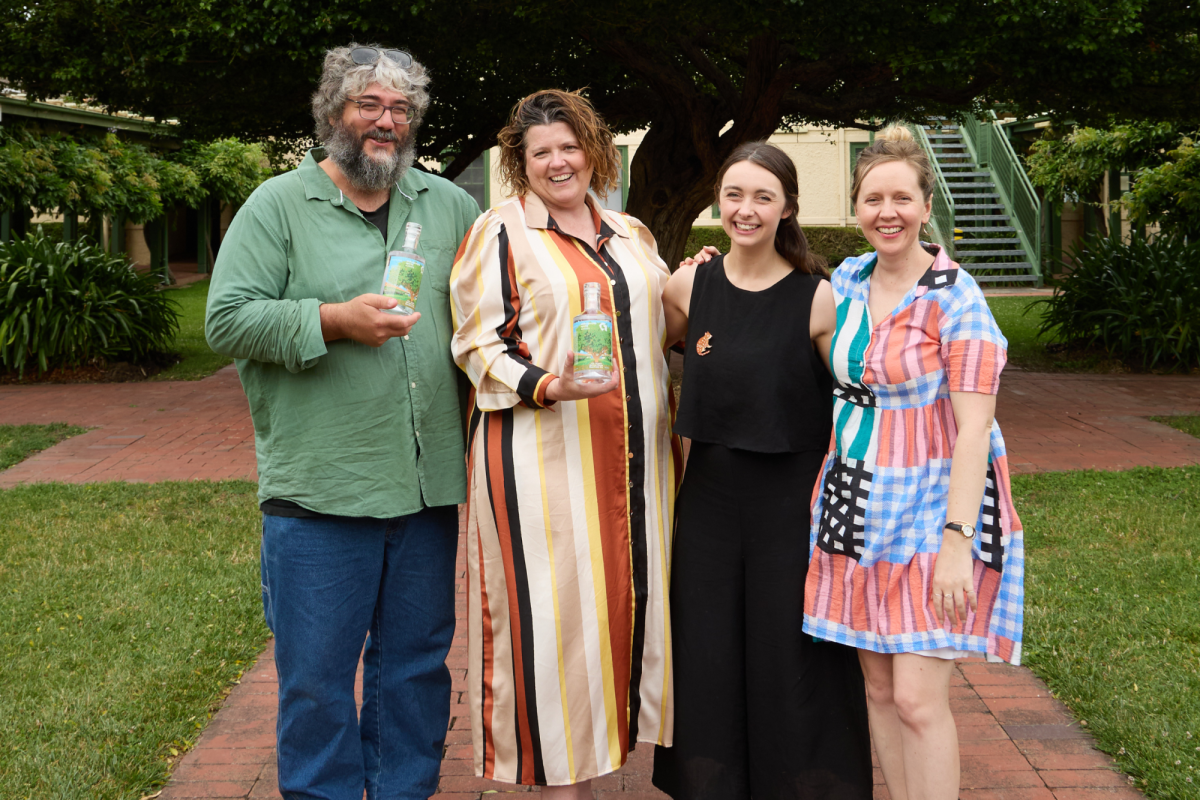 a group of people smiling in a courtyard