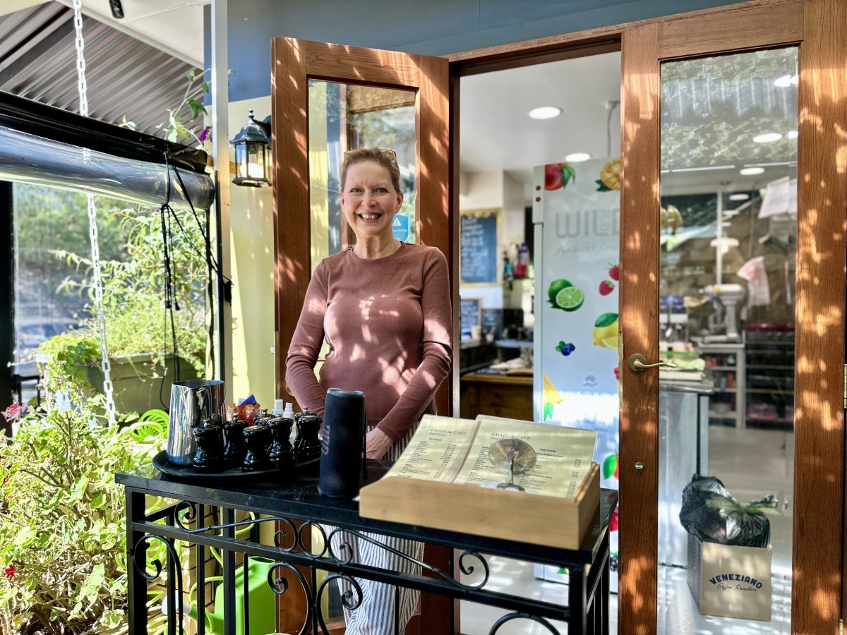 woman at entrance of cafe