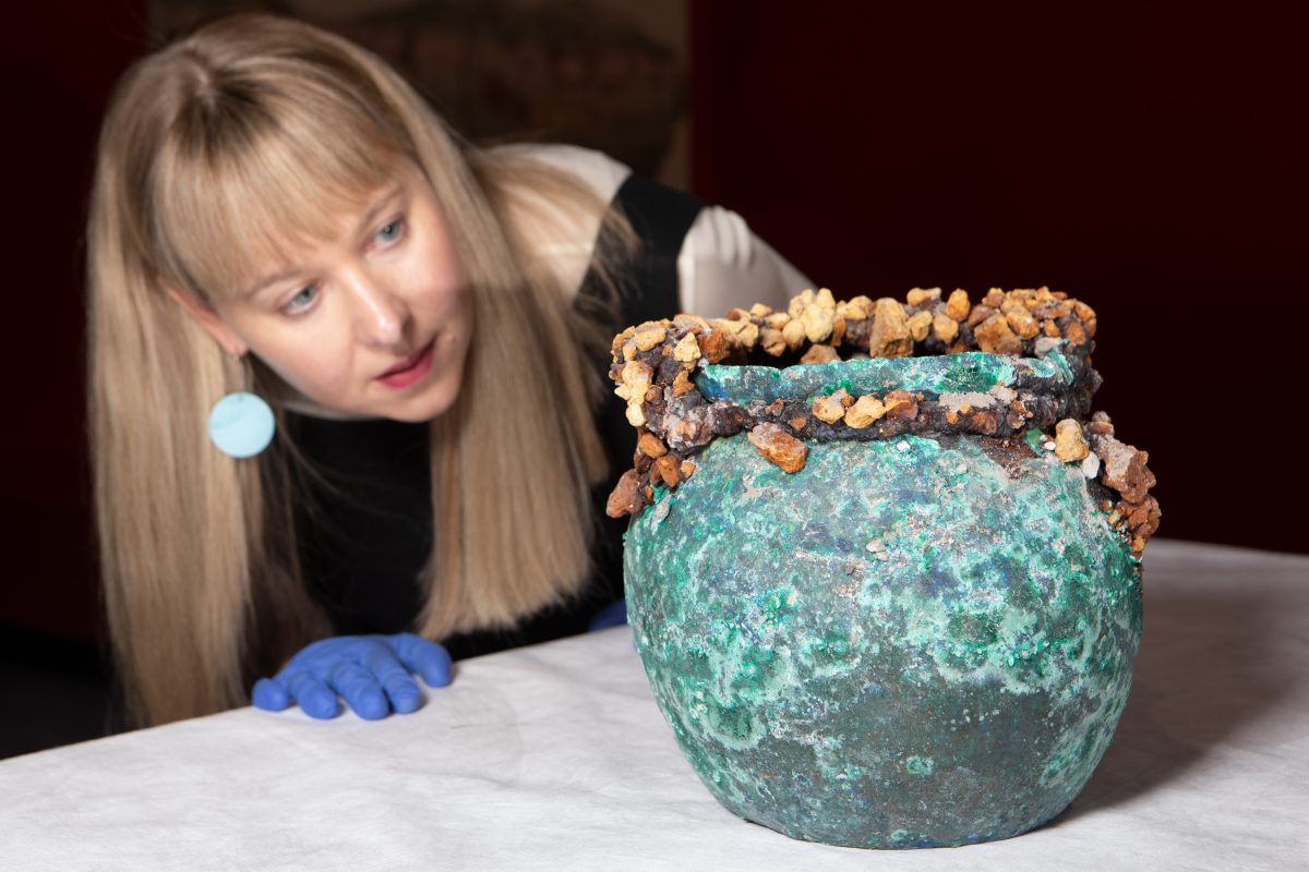 Pompeii exhibition curator Lily Withycombe looks at old blue pot