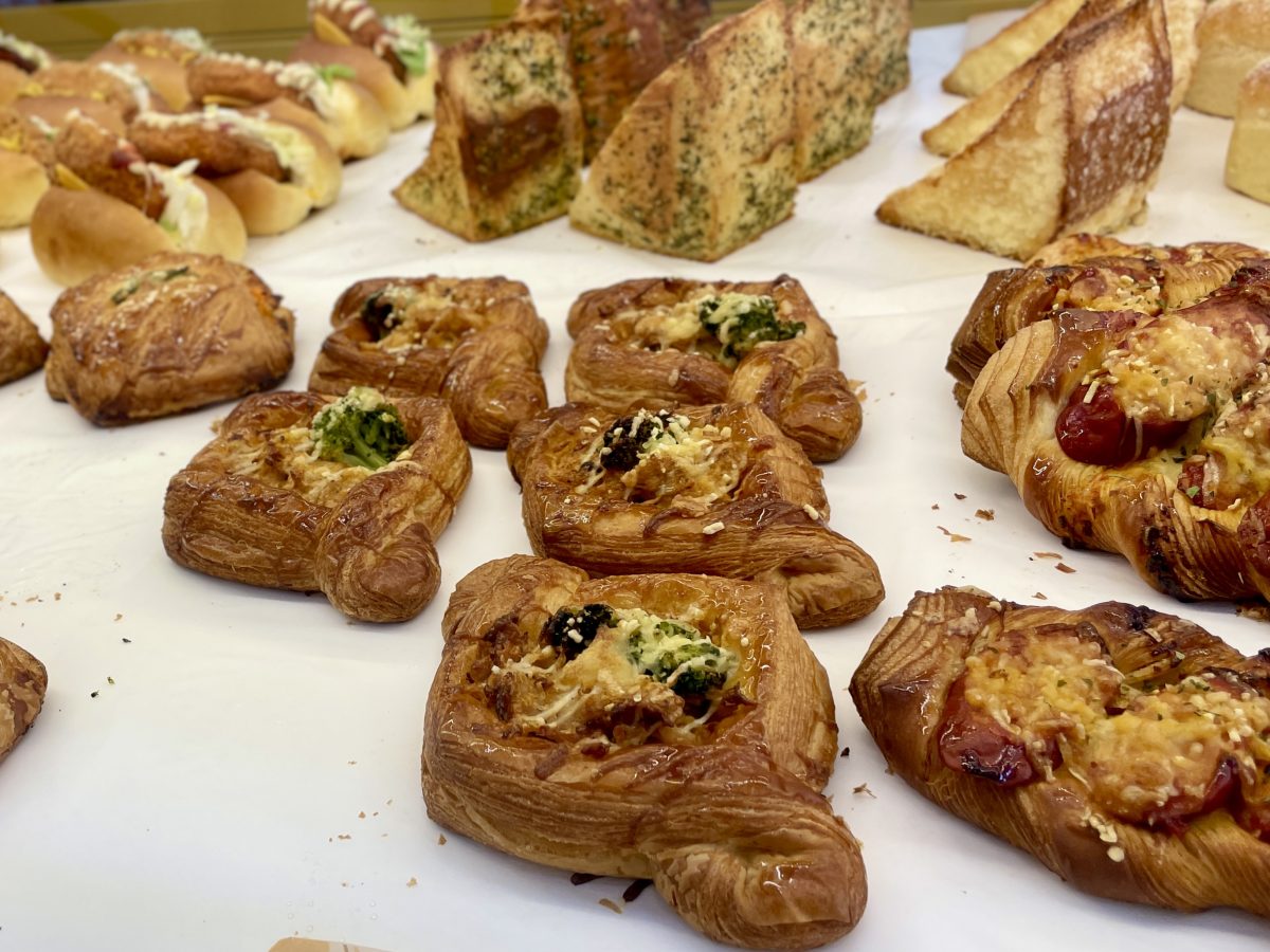 Danishes with a savoury filling in a pastry cabinet.
