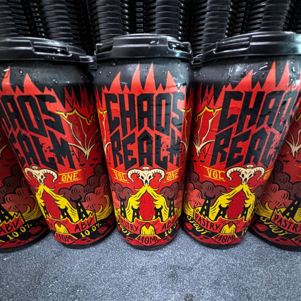Colourful beer cans reading Chaos Realm
